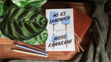 Ms Ice Sandwich by Mieko Kawakami with a brown leather sketchbook and crayons